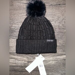 Black Calvin Klein beanie with pom-pom